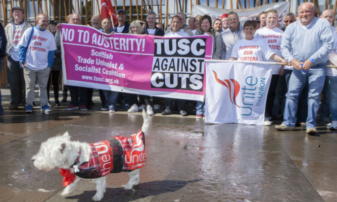 Striking porters gathered outside the Scottish Parliament to state their case.