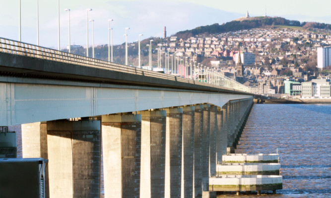 Lifeboat and coastguard teams are searching the water near the Tay Road Bridge.