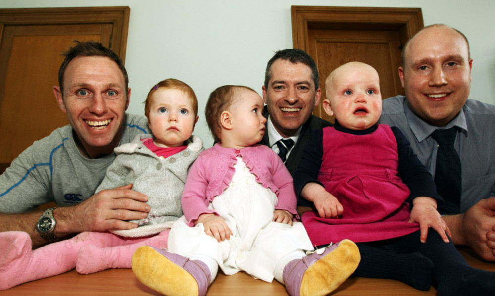 (From left) Craig Mueller-Ahsmann, with Grace Scarlett;  rector Andy Smith with Jessica Elizabeth; and Colin Oliphant with Amy.