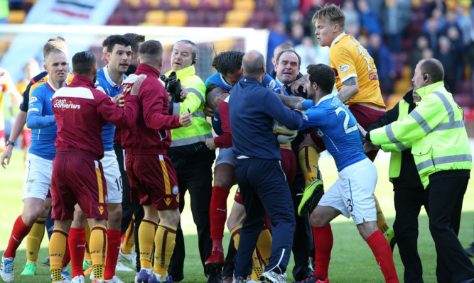 Rangers player Bilel Mohsni involved in a scuffle with Motherwell Lee Erwin (right) at full time.