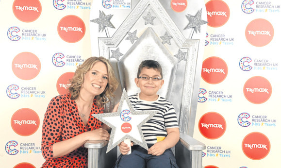 Good Morning Britain presenter Charlotte Hawkins with Dundee schoolboy Neevan Asad, who has won an award in recognition of his courage in fighting cancer.