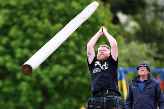 Kris Miller, Courier, 30/05/15. Picture today at Blackford Highland Games shows competition from the field where shot putt, hammer, caber tossing and other traditional sports took place alongside Highland dancing, running and cycling events. Pic shows tossing the caber.