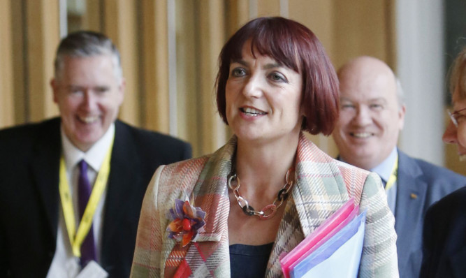 Angela Constance has announced £1m to implement review recommendations.