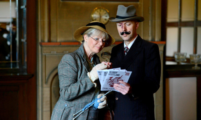 Best selling crime authors Christopher Brookmyre and Alex Gray get into character as Poirot and Miss Marple.
