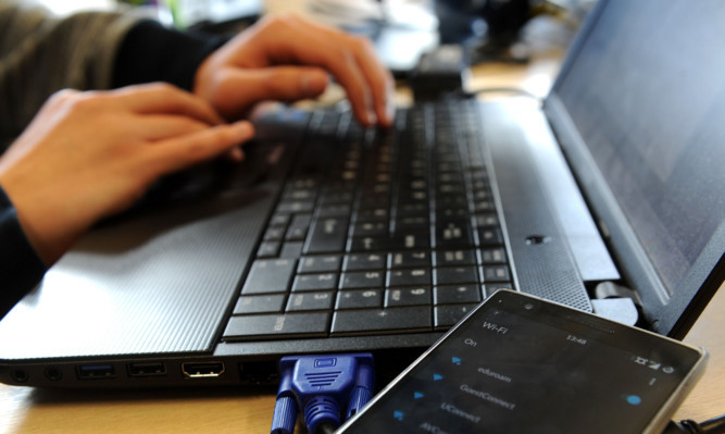 30.04.15 - invCYBER - pictured in Abertay University, Dundee for cyber crime feature by Craig Smith - are all WiFi hotstpots genuine?