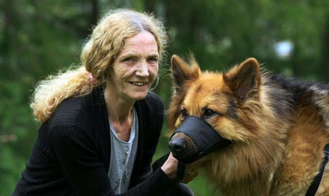 Barbara Philbin with Dylan. The family pet will be muzzled while out in public after he attacked a stranger last year, resulting in the man requiring hospital treatment.