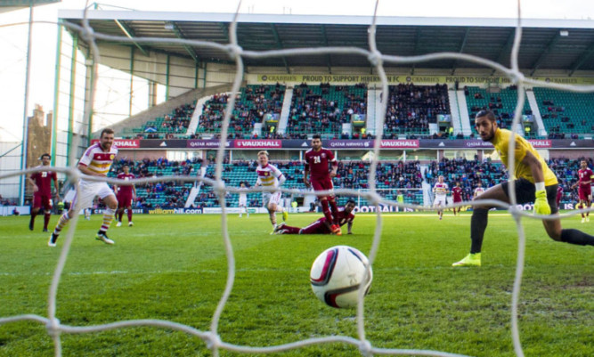 Scotland star Matt Richie (11) scores the game's only goal.