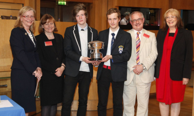 The winners with their trophy alongside deputy presiding officer Elaine Smith MSP; Christine McLintock, president of the Law Society of Scotland; John Mitchell of Hodder Gibson; and Lindsey McPhie, Glasgow Bar Association.