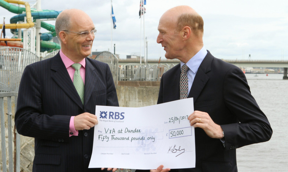 Ken Barclay (left) handing over the cheque for £50,000 to Sandy Richardson.