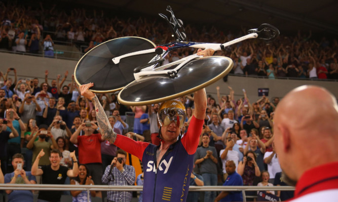 Sir Bradley Wiggins celebrates breaking the UCI One Hour Record.