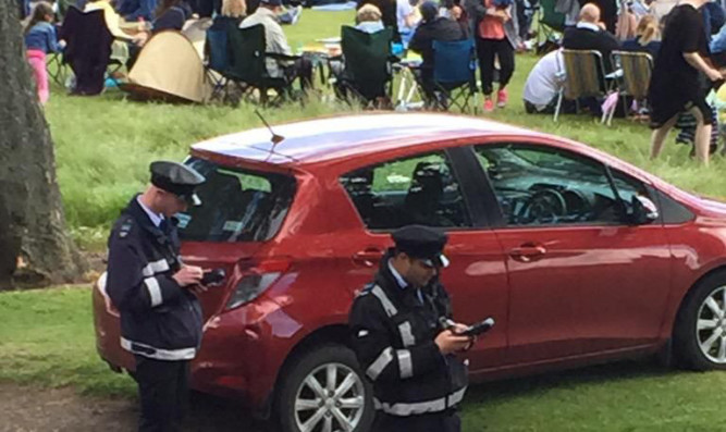 Traffic wardens handing out tickets during WestFest.