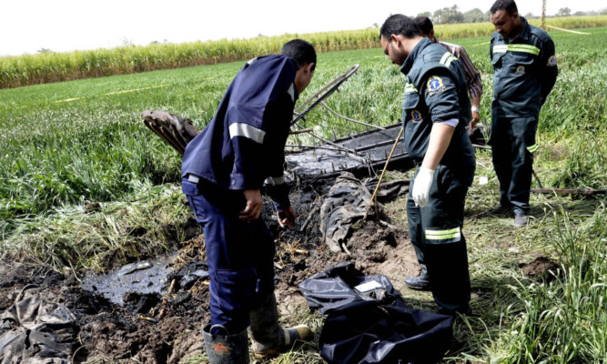 Egyptian rescue workers at the crash scene on 2013.