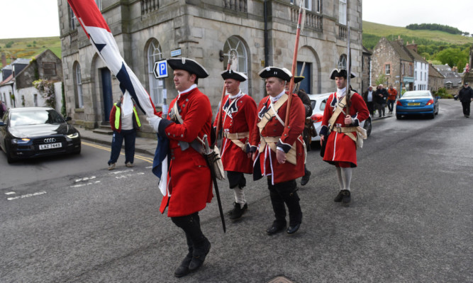 Redcoats on the march as the historical re-enactment takes place in Falkland.