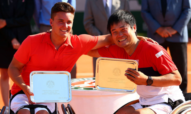 Gordon Reid celebrates with team-mate Shingo Kunieda.