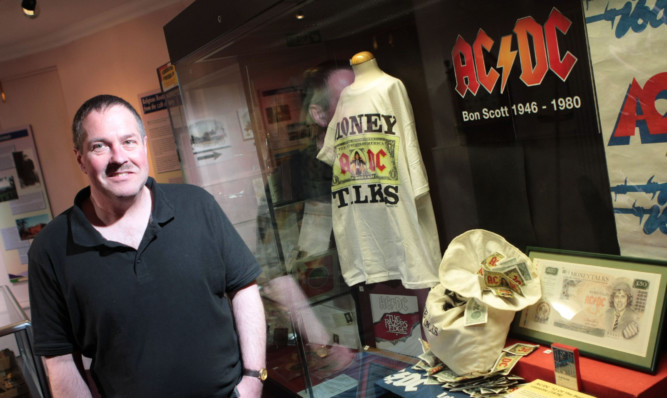 Neil McDonald with some of his AC/DC memorabilia at Kirriemuirs Gateway to the Glens Museum last month.