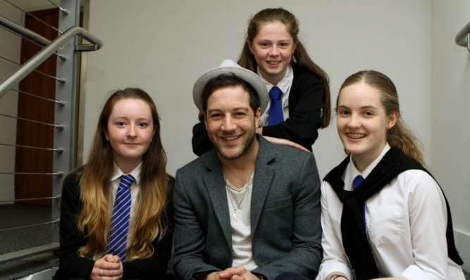 Matt Cardle with, from left, Amy Carnan, Elizabeth MacRae and Emily Jade-Barlow, who are fourth-year pupils from the Community School of Auchterarder.