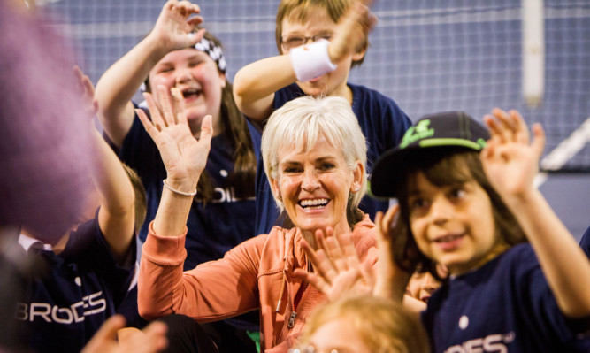 Judy Murray surrounded by some of the children at the event.