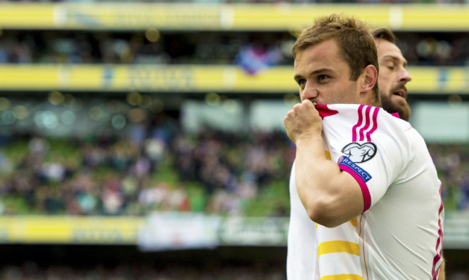 Scotland's Shaun Maloney celebrates after the equalising goal.