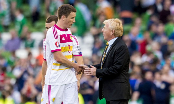 Craig Forsyth speaks with Gordon Strachan at the end of the game.
