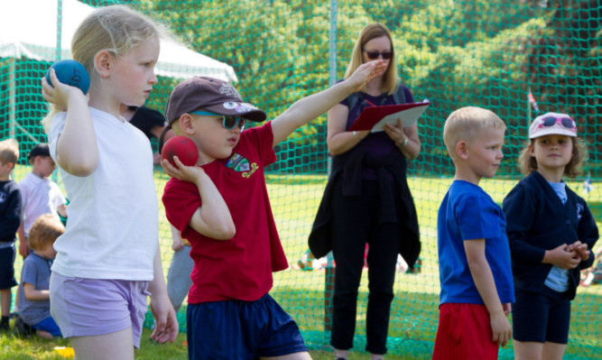 Youngsters get in on the action in the mini games in the grounds of Glamis Castle.