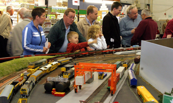 Enthusiasts enjoying the model railways at last year's event.