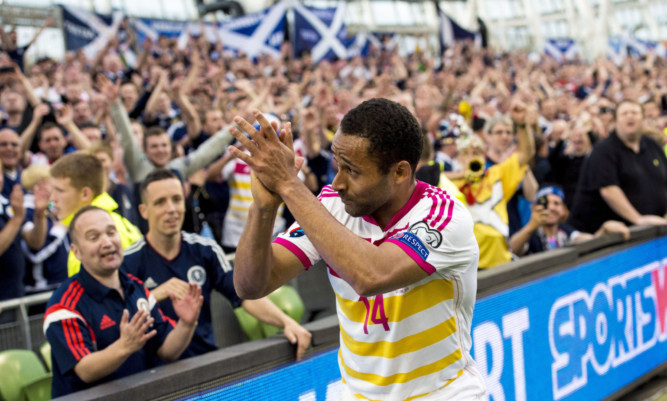 Ikechi Anya applauds the Tartan Army at the end of Saturdays game in Dublin.