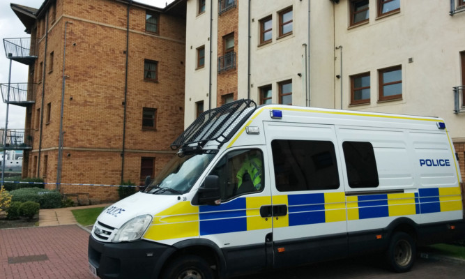 The 45-year-old was found dead in the flat at Deas Wharf on Sunday.