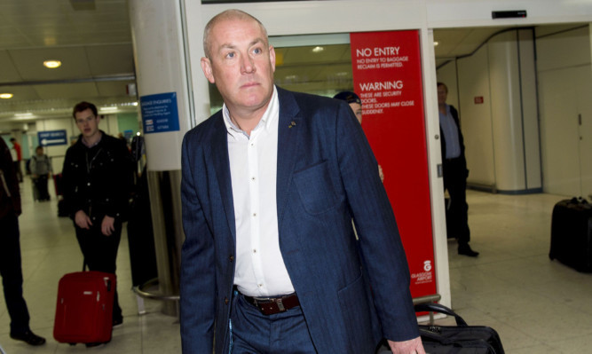 New Rangers manager Mark Warburton arrives in Glasgow.