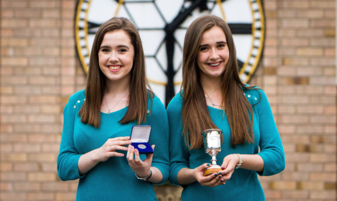 Twins Louise (left) and Sarah MacDougall with their prizes.