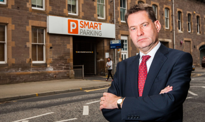 Murdo Fraser MSP outside the Kinnoull Street car park. He said Smart Parking would find it very difficult to take motorists to court over outstanding fees.