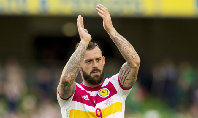 Steven Fletcher applauds the fans at full-time as Scotland make it four points from six against Ireland.