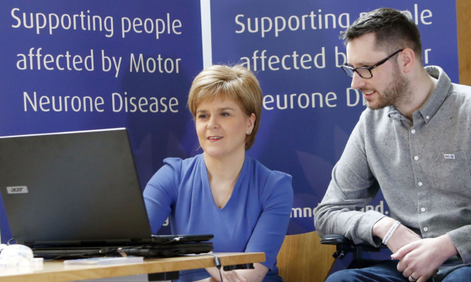 First Minister Nicola Sturgeon meets Motor Neurone Disease campaigner Gordon Aikman as they try cutting-edge eye-gaze voice technology.