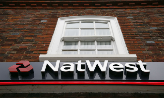 A National Westminster Bank branch (NatWest) logo in Beaconsfield, Buckinghamshire. ... Banks - stock ... 04-09-2014 ... Beaconsfield ... UK ... Photo credit should read: Jonathan Brady/Unique Reference No. 20815027 ... Picture date: Thursday September 4, 2014. Photo credit should read: Jonathan Brady/PA
