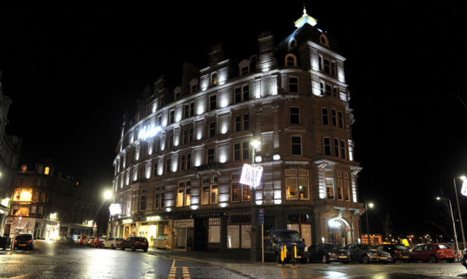 Dundee's Malmaison hotel lit up at night