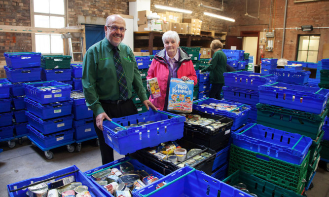 Food Bank Manager Alf Collington with vice convener of communities Jeanette Gauld
P.