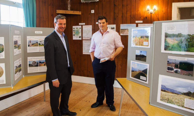 Neil Sutherland, regional director for Wardell Armstrong, with John Lindsay, senior development officer for Lightsource Renewable Energy Ltd, with some of the information on display.