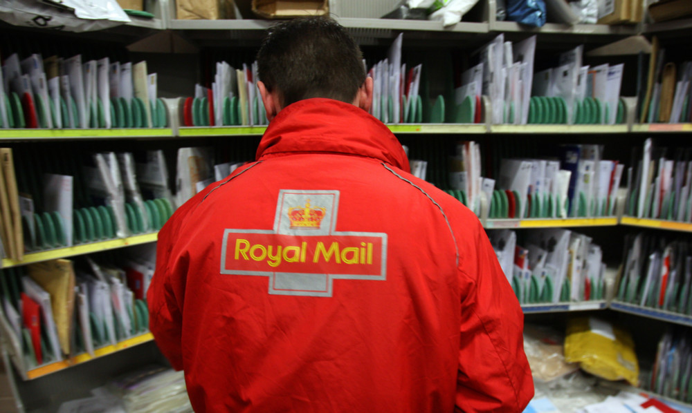 Kris Miller, Courier, 14/12/12. Picture today shows scenes from the Royal Mail sorting office in Dundee West, Baird Avenue. For story on post service around Christmas time. Pic shows staff sorting and preparing mail and parcels for delivery.