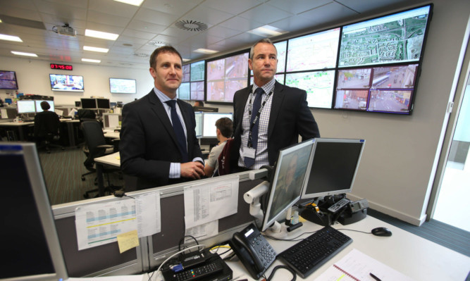 Justice secretary Michael Matheson (left) with Detective Inspector Ryan Lothian at the Scottish Crime Campus Joint Operational command centre.