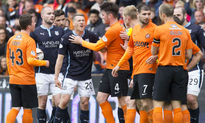 Dundee's Jim McAlister (fourth from left) vents his frustration at Nadir Ciftci (third from right) after the incident.