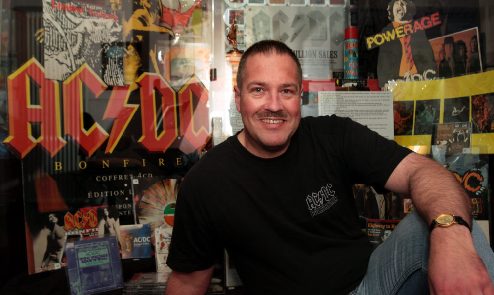 Neil McDonald with some of his extensive collection of Bon Scott and AC/DC memorabilia.