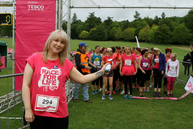 Brave Aimi Munro  who had surgery to reduce the risk of her developing the breast cancer that claimed the life of her mum  led a pink army of more than 1,700 at Cancer Research UKs Dundee Race for Life. The 32-year-old from Carnoustie was chosen as the Camperdown Parks VIP and took part with her pet dogs, Harley and Byron, after sounding the airhorn to start the 5K and 10K races.