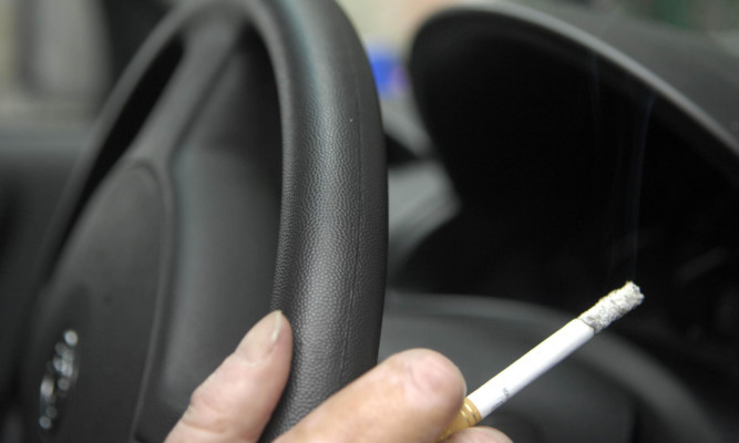 Police would be charged with fining people caught smoking with a child in their car.