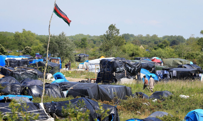 Migrants camp in squalid conditions in Calais.