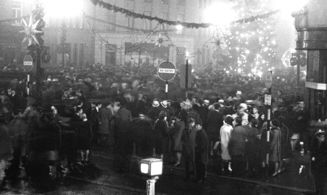 People celebrating Hogmanay in City Square in the 1960s.