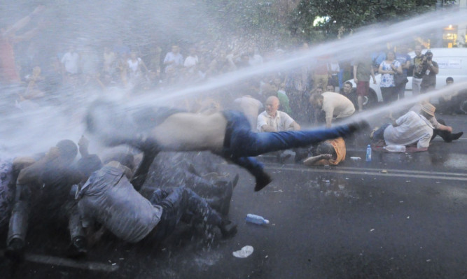 Armenian police use water cannons to disperse protesters demonstrating an increase in electricity prices in the capital of Yerevan.