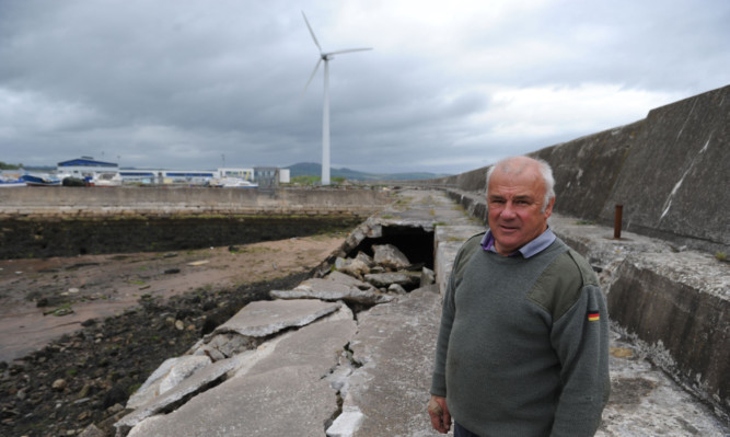 John Johnstone with the collapsed wall in Dock No 3 at Methil Harbour.