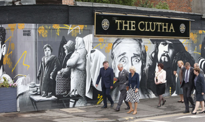 The Duke and Duchess of Rothesay with the Clutha Bar's owner Alan Crossan (left) outside the Clutha in Glasgow.