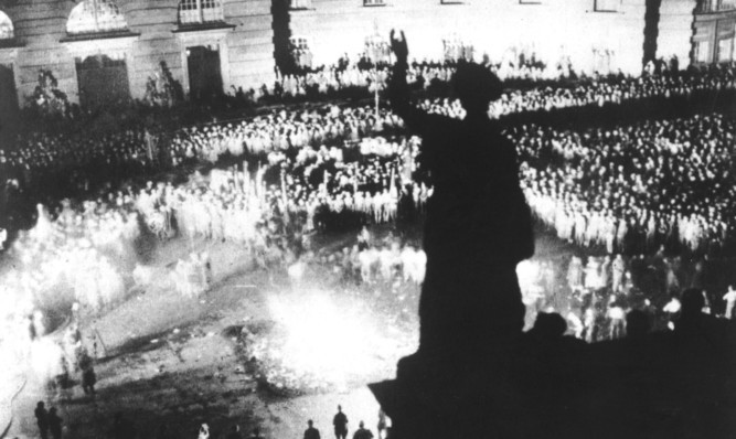 A crowd of 40,000 people watch 'un-German' books, by authors not considered to conform to Nazi ideaology, being burned in the Berlin in 1933. The crowd was addressed by Nazi propaganda minister Joseph Goebbels.