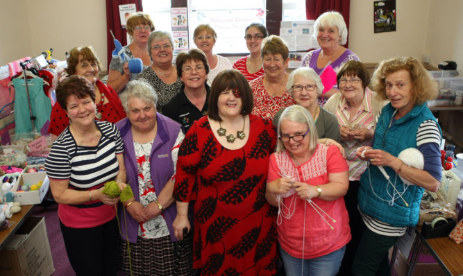 Kelty members at the eighth birthday bash of the mother group, which saw them raise £250.