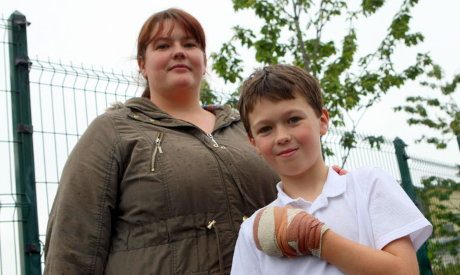 Kieran and his mother Gillian face an anxious wait over the damage to his hand.